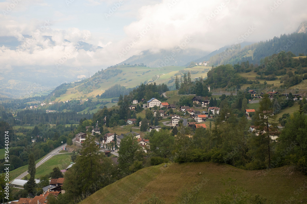 View on a small village on a mountain slope in canton Graubünden, South-East Switzerland