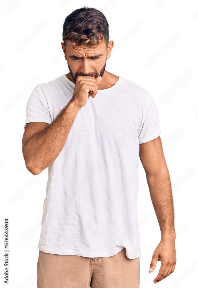 Young hispanic man wearing casual white tshirt feeling unwell and coughing as symptom for cold or bronchitis. health care concept. Young hispanic man wearing casual white tshirt feeling unwell and coughing as symptom for cold or bronchitis. health care concept.