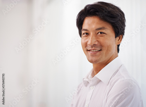 Hes got what it takes to be a leader. Portrait of a handsome businessman smiling at the camera.