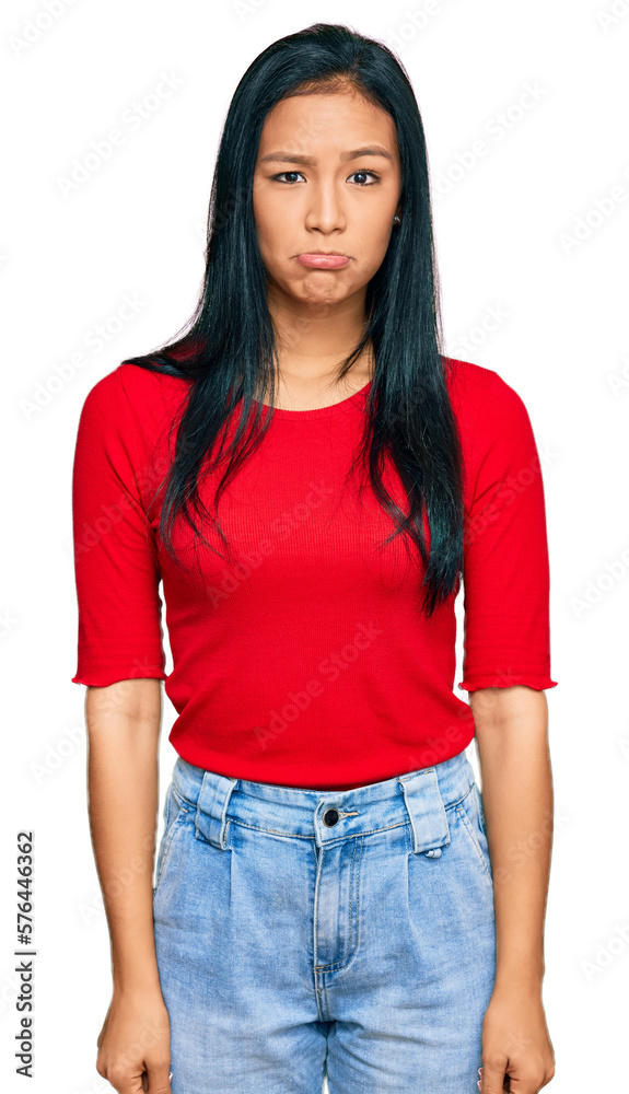 Beautiful hispanic woman wearing casual clothes depressed and worry for distress, crying angry and afraid. sad expression. Beautiful hispanic woman wearing casual clothes depressed and worry for distress, crying angry and afraid. sad expression.