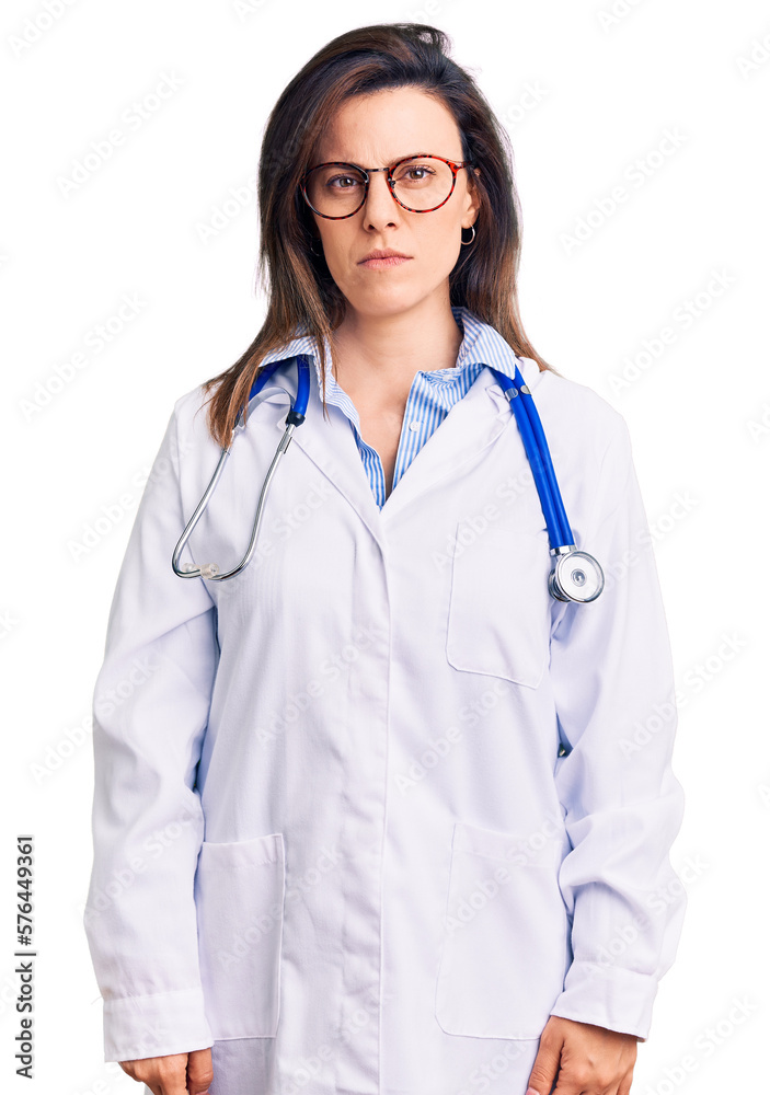 Young beautiful woman wearing doctor stethoscope and glasses skeptic and nervous, frowning upset because of problem. negative person. Young beautiful woman wearing doctor stethoscope and glasses skeptic and nervous, frowning upset because of problem. negative person.