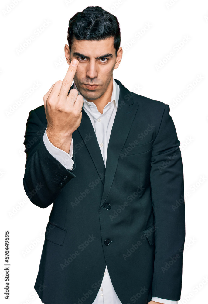 Handsome hispanic man wearing business clothes showing middle finger, impolite and rude fuck off expression Handsome hispanic man wearing business clothes showing middle finger, impolite and rude fuck off expression