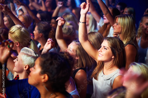 A group of adoring fans singing along to their favorite song. This concert was created for the sole purpose of this photo shoot, featuring 300 models and 3 live bands. All people in this shoot are