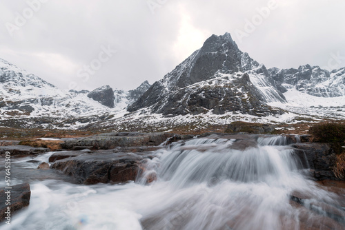 White snow mountain in Lofoten islands, Nordland county, Norway, Europe. Hills and trees, nature landscape in winter season. Winter background.