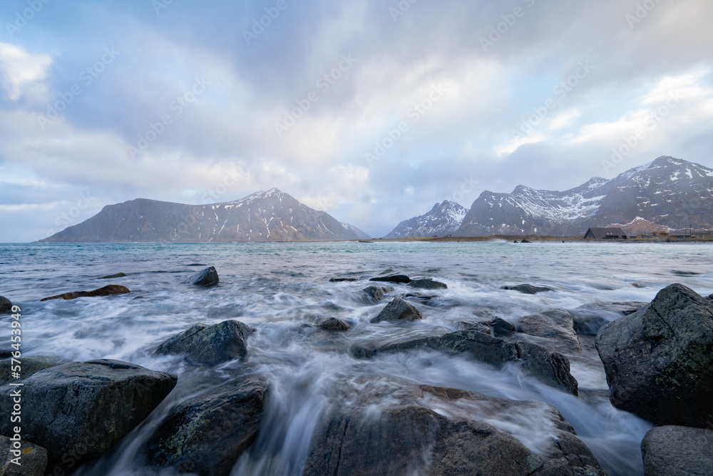 Obraz premium White snow mountain in Lofoten islands, Nordland county, Norway, Europe. Hills and trees, nature landscape in winter season. Winter background.