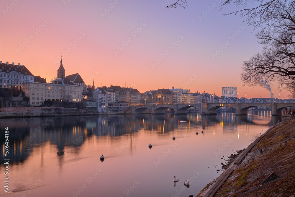 Beautiful sunset on the banks of the Rhine River, in the city of Basel, Switzerland.