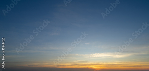 Sunset sky. Abstract nature background. Dramatic blue with orange colorful clouds in twilight time.