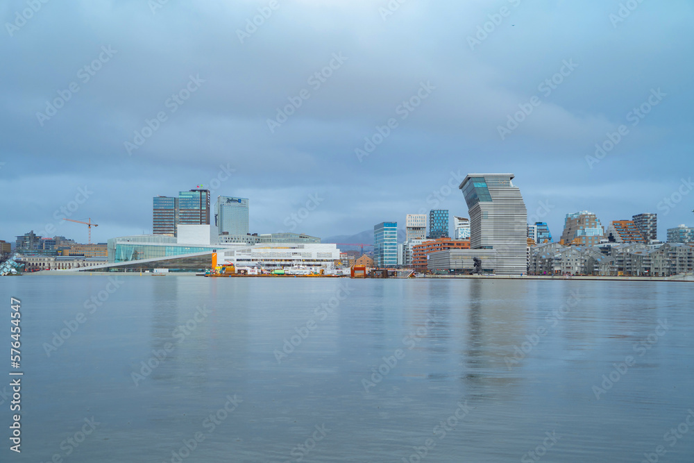 Oslo Downtown Skyline, Norway. Financial district and business centers in smart urban city in Europe. Skyscraper and high-rise buildings at night.