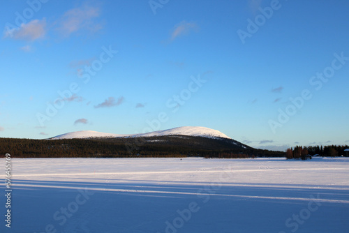 View on the surrounding hills from fhe frozen lake of Äkäslompolo, a village in Finland's Lapland region.	
