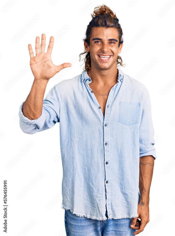 Young hispanic man wearing summer style showing and pointing up with fingers number five while smiling confident and happy. Young hispanic man wearing summer style showing and pointing up with fingers number five while smiling confident and happy.