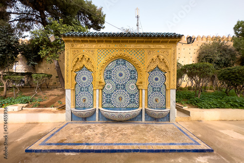 Traditional Moroccan wall fountain in a Jnan Sbil Gardens in Fez photo