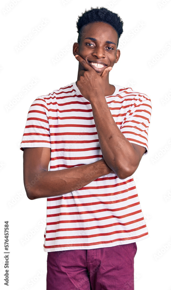 Young african american man wearing casual clothes looking confident at the camera smiling with crossed arms and hand raised on chin. thinking positive. Young african american man wearing casual clothes looking confident at the camera smiling with crossed arms and hand raised on chin. thinking positive.