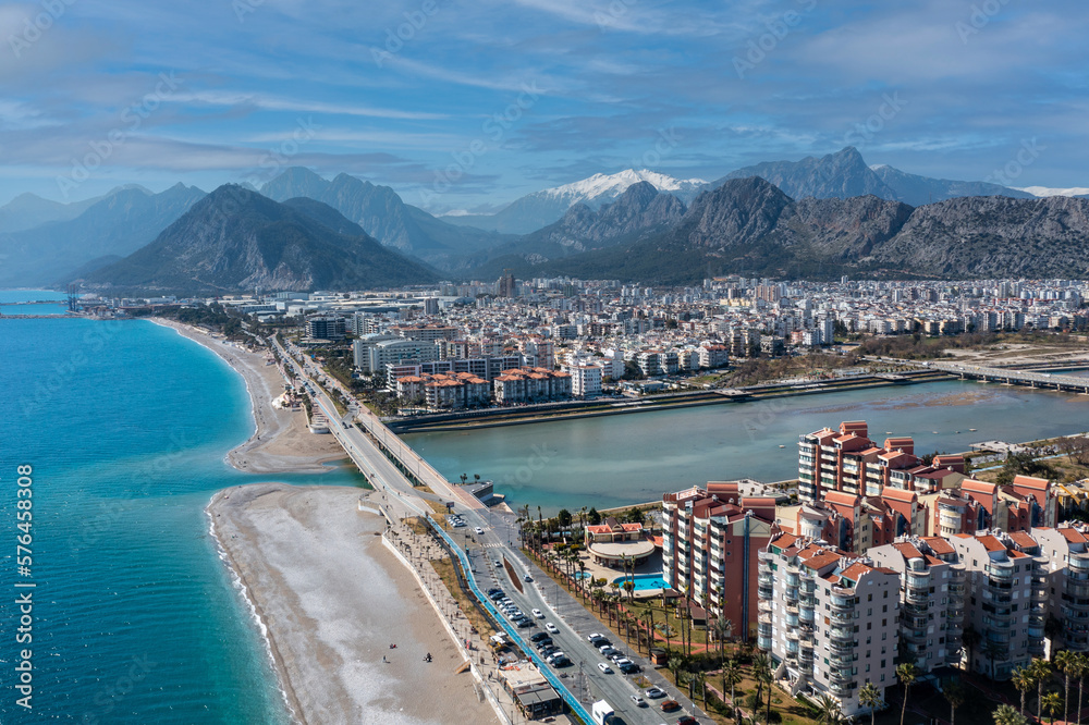 The Mediterranean, the famous Konyaaltı beach, the city of Antalya and the Taurus Mountains behind. Turkey
