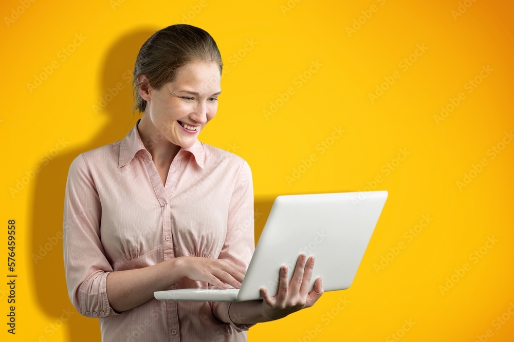 Happy business woman working with laptop Happy business woman working with laptop