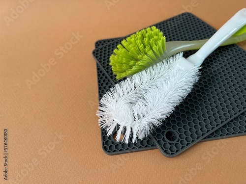 Dishwashing brush and silicone tack. Banner cleaning