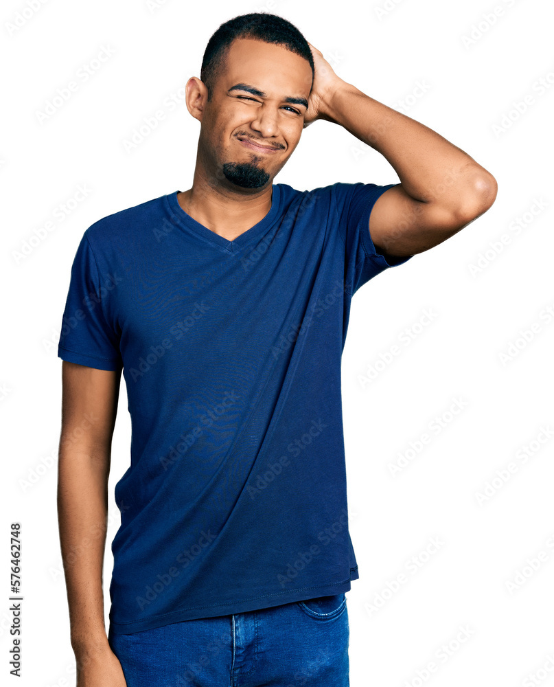 Young african american man wearing casual t shirt confuse and wonder about question. uncertain with doubt, thinking with hand on head. pensive concept. - obrazy, fototapety, plakaty 