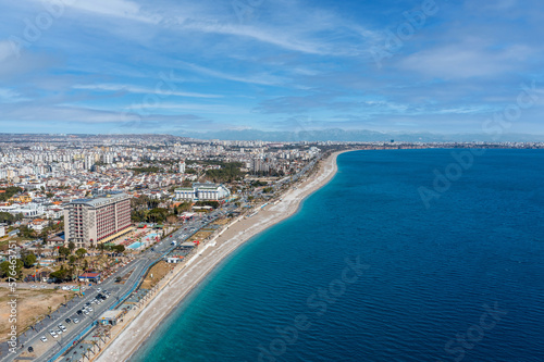 The Mediterranean, the famous Konyaaltı beach, the city of Antalya and the Taurus Mountains behind. Turkey 