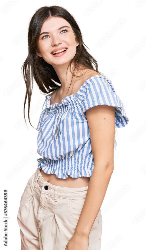 Fototapeta premium Young beautiful caucasian girl wearing casual clothes looking away to side with smile on face, natural expression. laughing confident.