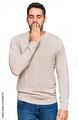 Young hispanic man wearing casual clothes bored yawning tired covering mouth with hand. restless and sleepiness. © Krakenimages.com