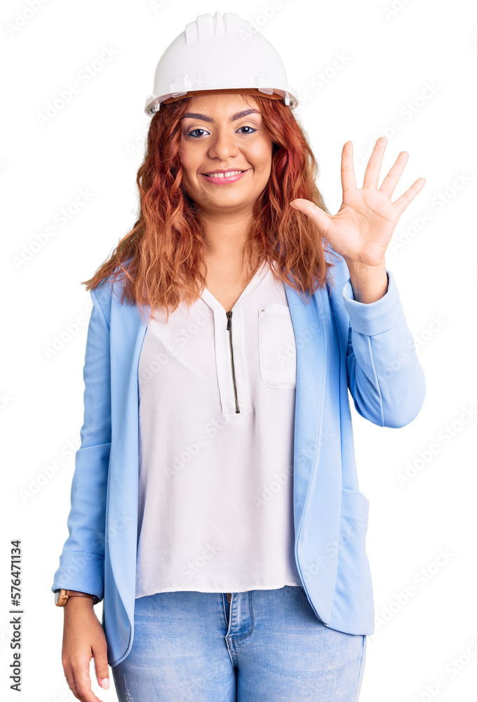 Young latin woman wearing architect hardhat showing and pointing up with fingers number five while smiling confident and happy. Young latin woman wearing architect hardhat showing and pointing up with fingers number five while smiling confident and happy.