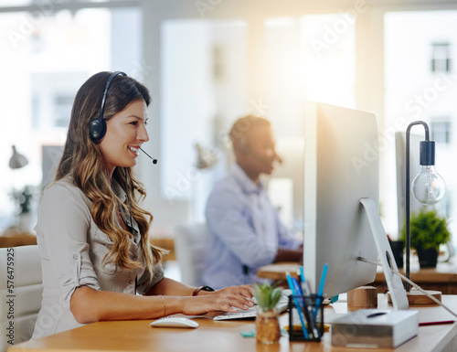 You add value to people when you value them. Shot of a female agent working in a call centre. photo