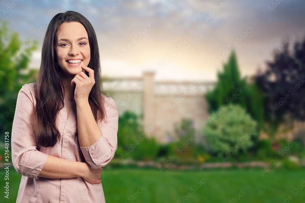 Happy young happy woman posing on outdoor background Happy young happy woman posing on outdoor background