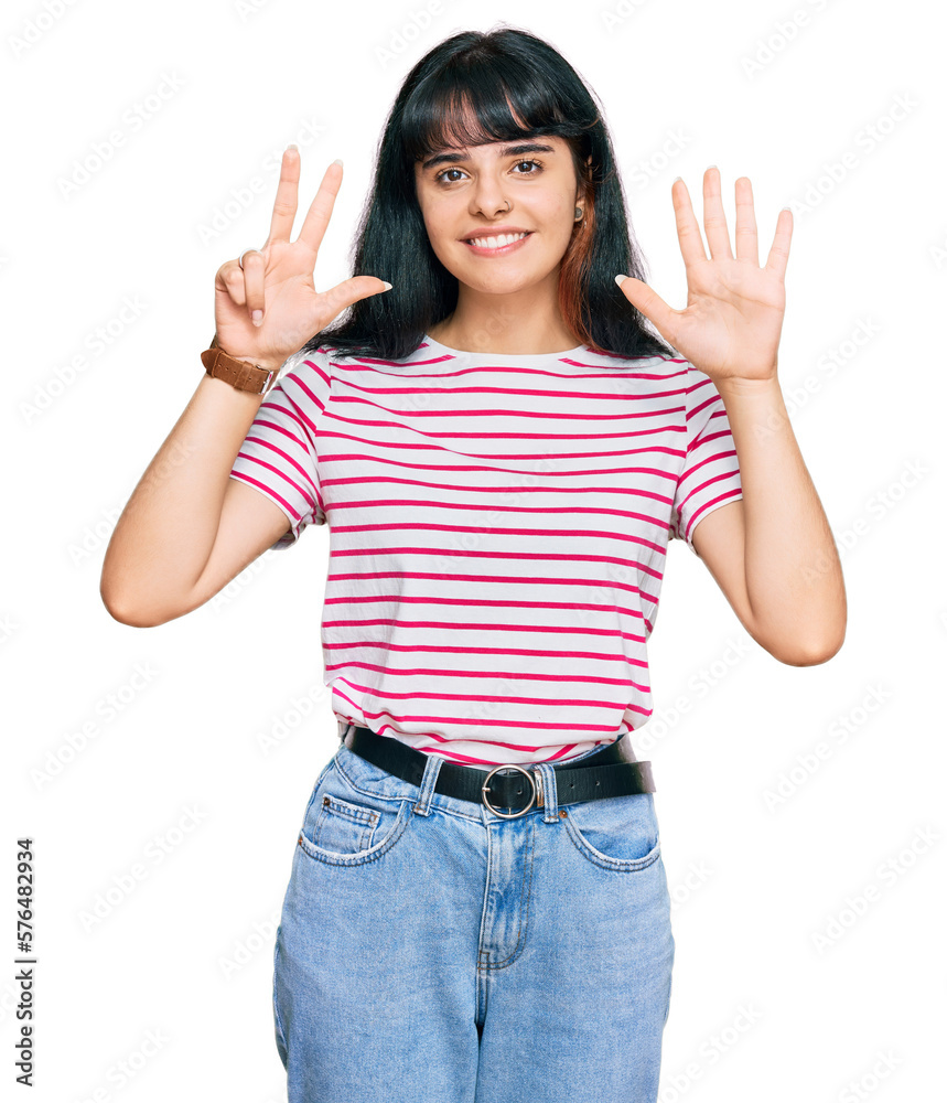 Young hispanic girl wearing casual clothes showing and pointing up with fingers number eight while smiling confident and happy. Young hispanic girl wearing casual clothes showing and pointing up with fingers number eight while smiling confident and happy.
