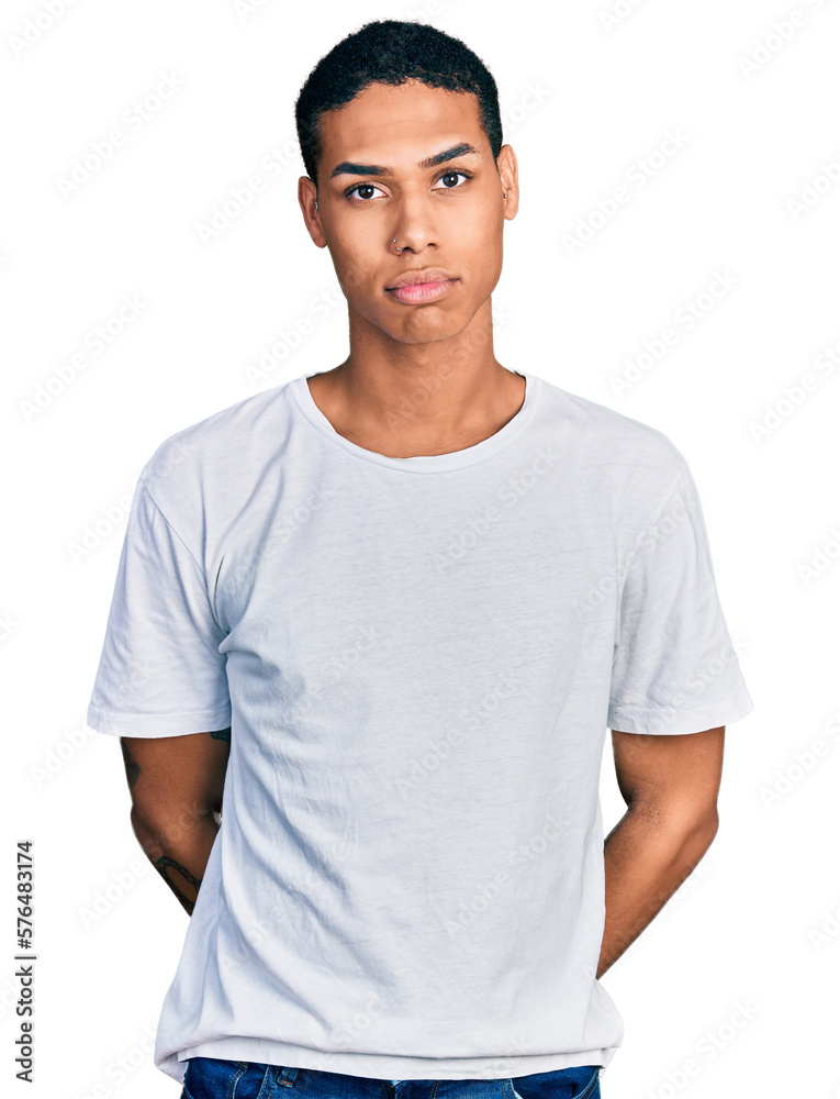 Young hispanic man wearing casual white t shirt depressed and worry for distress, crying angry and afraid. sad expression. Young hispanic man wearing casual white t shirt depressed and worry for distress, crying angry and afraid. sad expression.