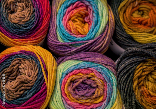 Multicolored skeins of wool for knitting as a background.