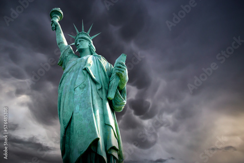 Statue of Liberty in a stormy background