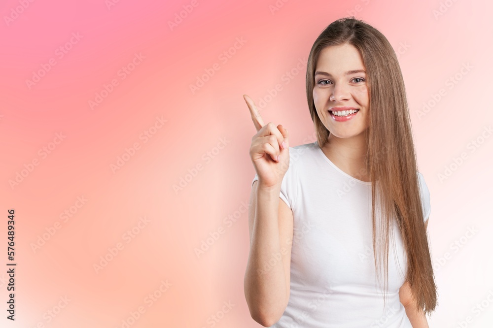 Young lovely woman posing pointing finger Young lovely woman posing pointing finger