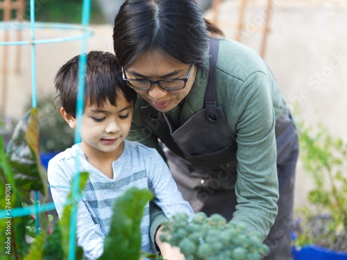 Mom and son tending the garden