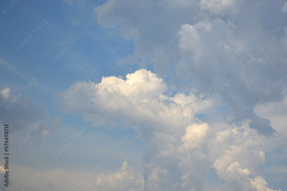 Sunbeams or light beams breaking through the clouds on a blue sky during sunset. Beautiful spectacular concept background for meditation or yoga Sunbeams or light beams breaking through the clouds on a blue sky during sunset. Beautiful spectacular concept background for meditation or yoga