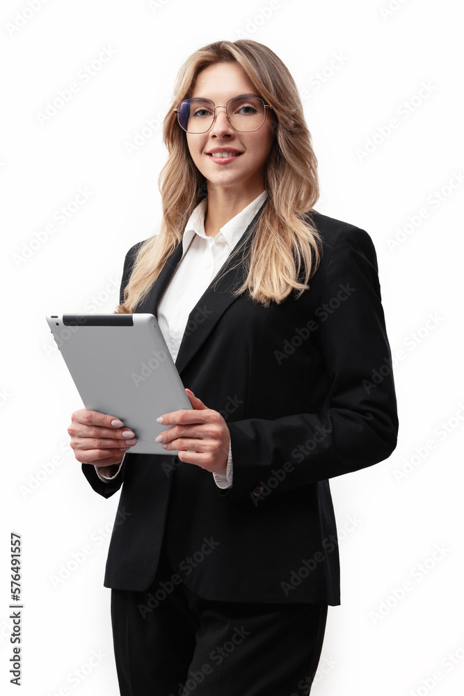 Young business woman or office worker wearing a black suit holding a tablet. Smiling business woman isolated on white background
Young business woman or office worker wearing a black suit holding a tablet. Smiling business woman isolated on white background