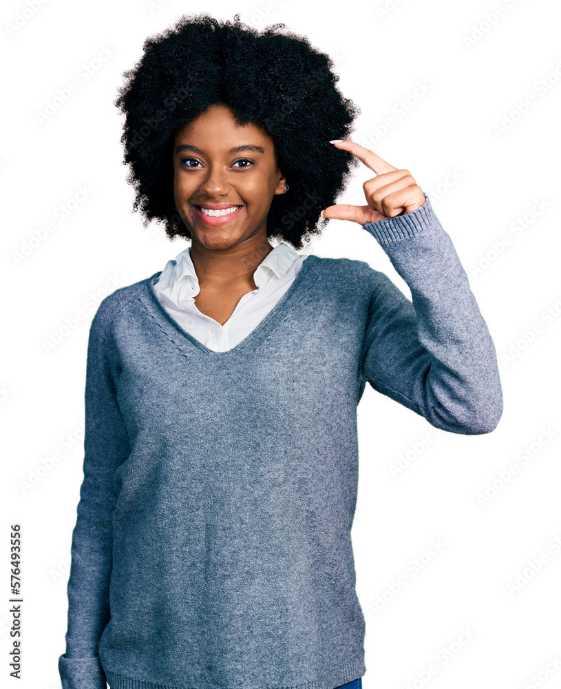 Young african american woman wearing business clothes smiling and confident gesturing with hand doing small size sign with fingers looking and the camera. measure concept. Young african american woman wearing business clothes smiling and confident gesturing with hand doing small size sign with fingers looking and the camera. measure concept.