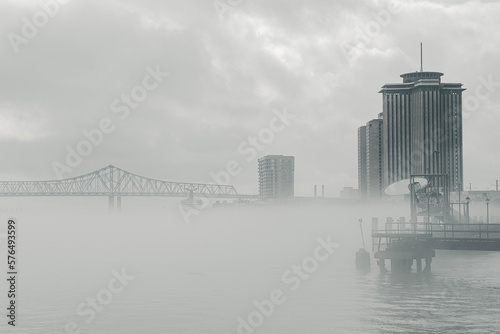 View of cityscape by river on a foggy morning in Luisiana photo