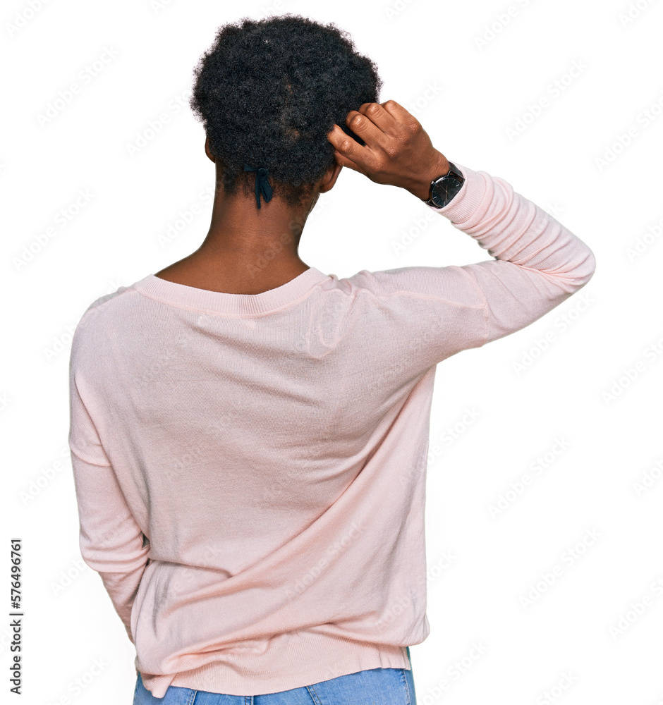 Young african american girl wearing casual clothes backwards thinking about doubt with hand on head Young african american girl wearing casual clothes backwards thinking about doubt with hand on head