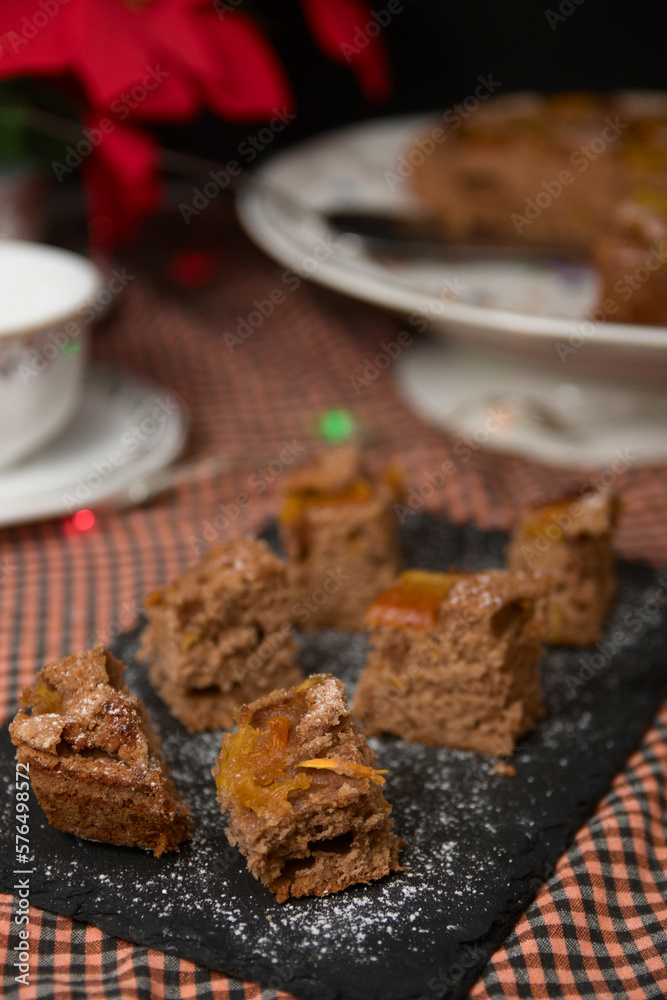 Still life of some slices of home baked papaya cake next to some cups of coffee Still life of some slices of home baked papaya cake next to some cups of coffee
