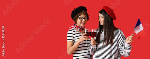 Young lesbians with flag of...