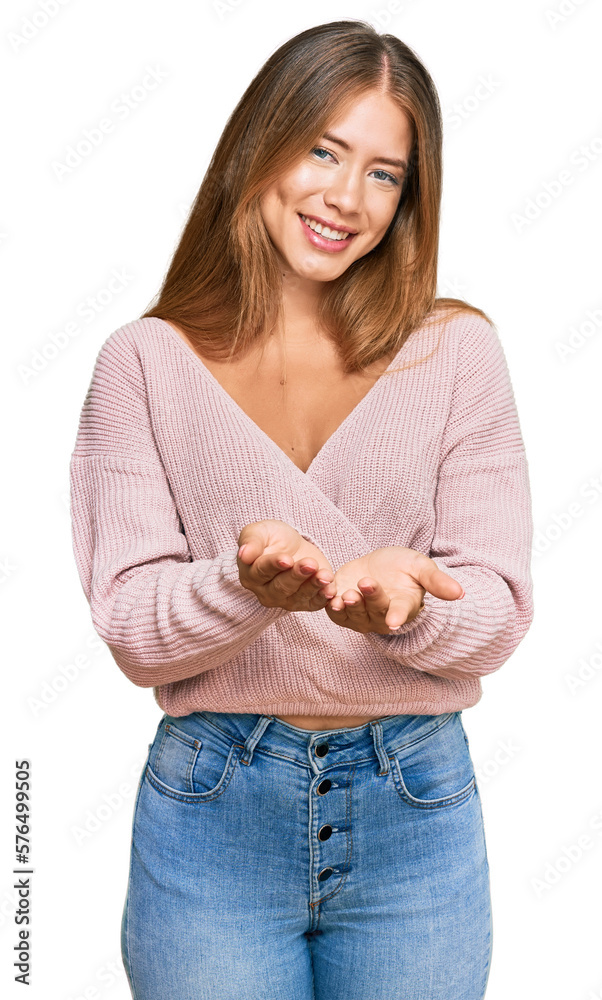 Beautiful blonde woman wearing casual winter pink sweater smiling with hands palms together receiving or giving gesture. hold and protection Beautiful blonde woman wearing casual winter pink sweater smiling with hands palms together receiving or giving gesture. hold and protection