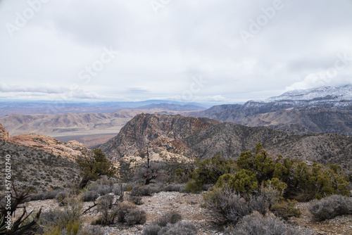 Desert landscape with mountain background and blue sky with white clouds © Martina