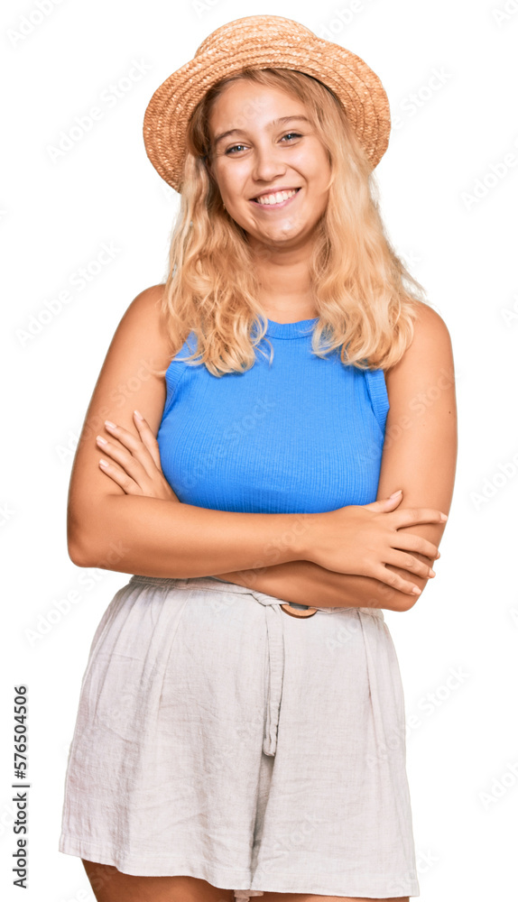Young blonde girl wearing summer hat happy face smiling with crossed arms looking at the camera. positive person. Young blonde girl wearing summer hat happy face smiling with crossed arms looking at the camera. positive person.