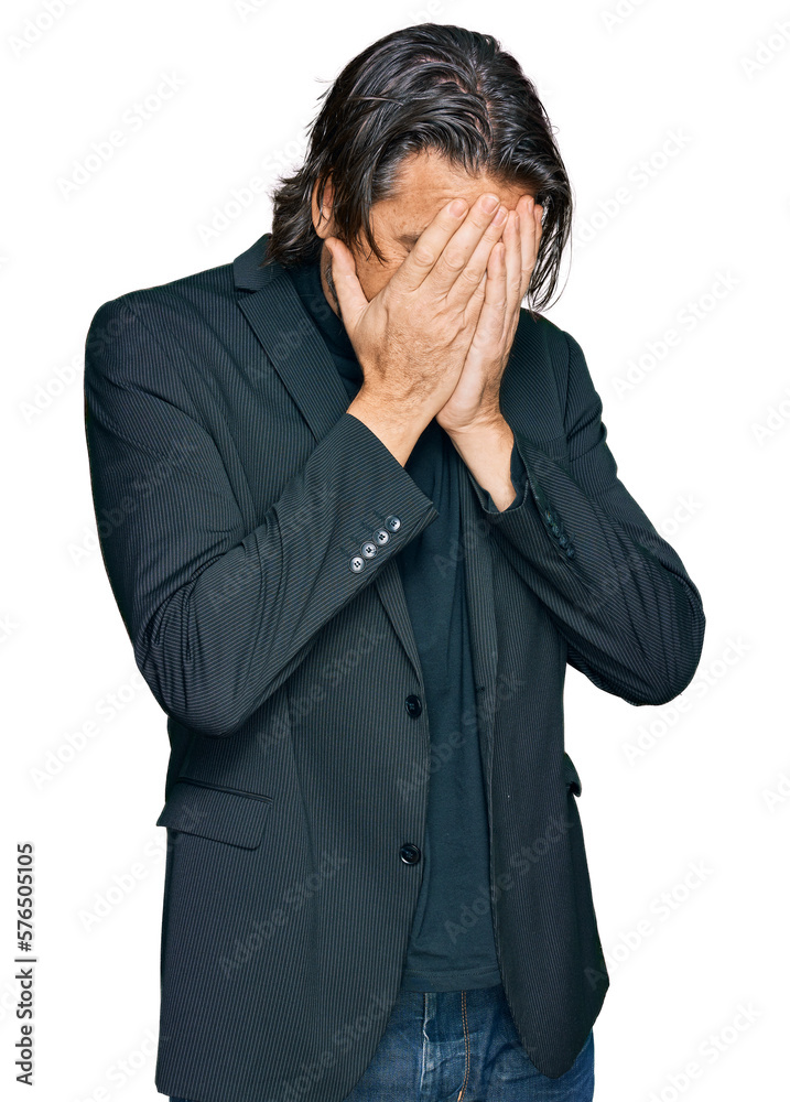 Middle age handsome man wearing business clothes with sad expression covering face with hands while crying. depression concept. Middle age handsome man wearing business clothes with sad expression covering face with hands while crying. depression concept.