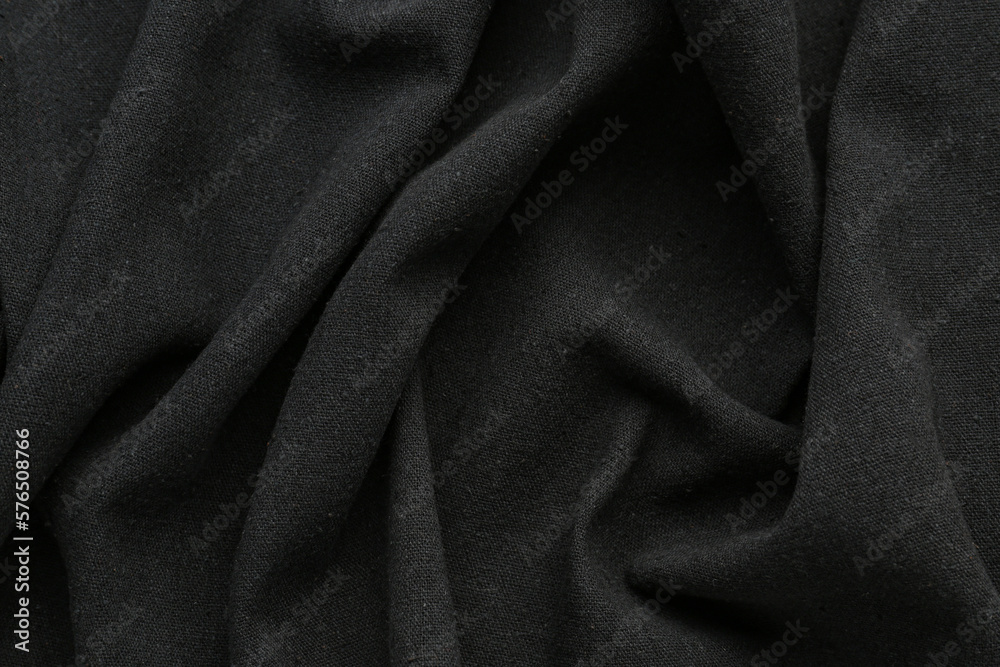 Fototapeta premium Closeup view of crumpled black fabric as background