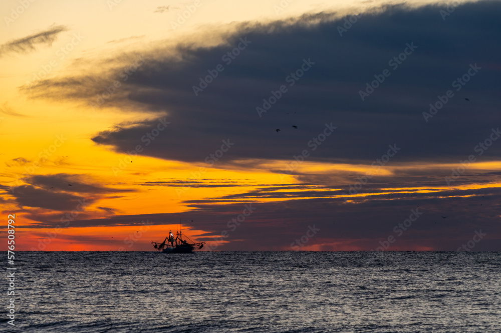Fishing Boat, Red Sky and Big Clouds