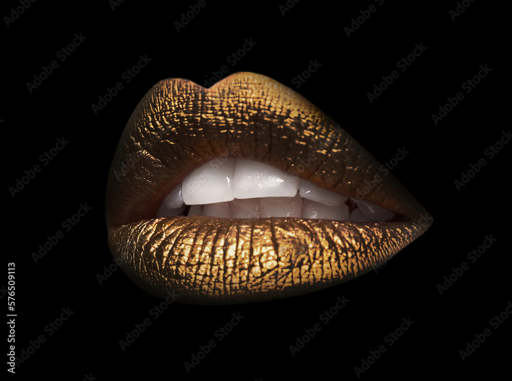 Beautiful lips with shiny golden lipstick on black background