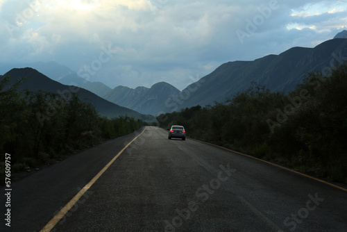 Beautiful view of car on asphalt highway in mountains. Road trip © New Africa
