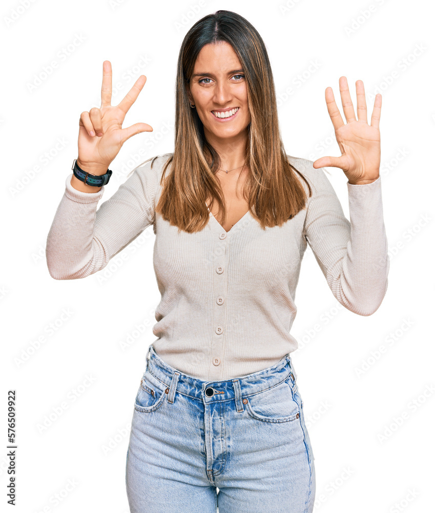 Young woman wearing casual clothes showing and pointing up with fingers number eight while smiling confident and happy. Young woman wearing casual clothes showing and pointing up with fingers number eight while smiling confident and happy.