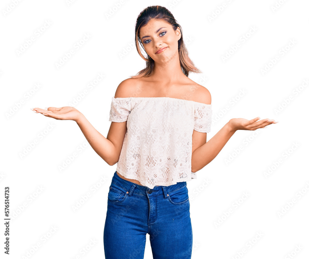 Young beautiful woman wearing casual clothes clueless and confused expression with arms and hands raised. doubt concept. Young beautiful woman wearing casual clothes clueless and confused expression with arms and hands raised. doubt concept.