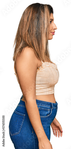 Obraz na plátně Beautiful brunette woman wearing casual clothes looking to side, relax profile pose with natural face with confident smile